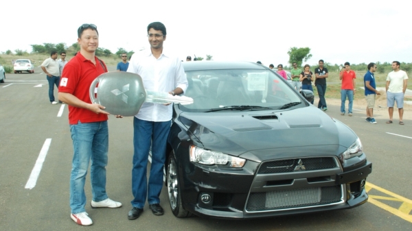  - Mr.Yoshiaki-Wada-Head-Marketing-and-Channel-Development-HM-Mitsubishi-Motors-handing-over-the-keys-of-the-Lancer-Evolution-X-to-veteran-rally-champion-Naren-Kumar